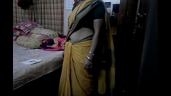 Desi Tamil Aunty In Saree Moans As She Teases Her Bare Navel, Her Wedding Bangles Clinking With Every Seductive Move.